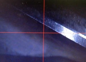 two close up images comparing an end mill with no tool wear and another with excessive tool wear
