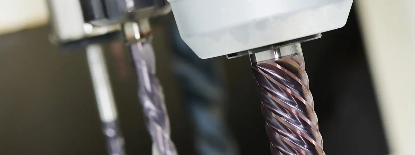 image of three end mills secured in their respective tool holders