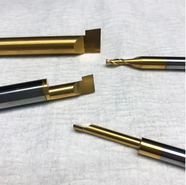 four different gold edge turning tools