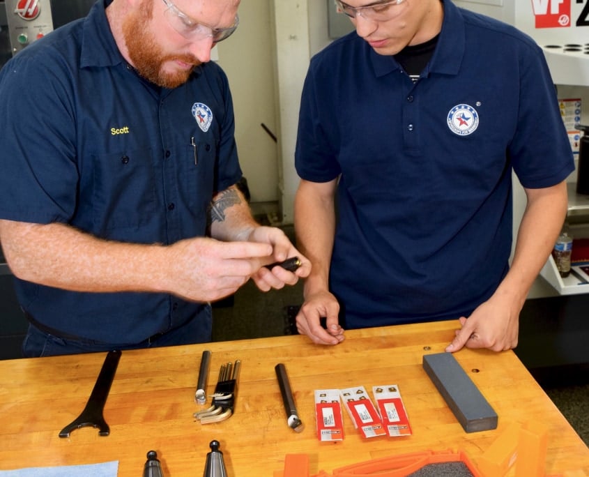 man teaching about machining tool holder
