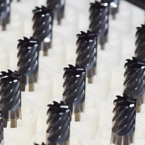 multiple end mills after being coated, zoomed in on cutting faces