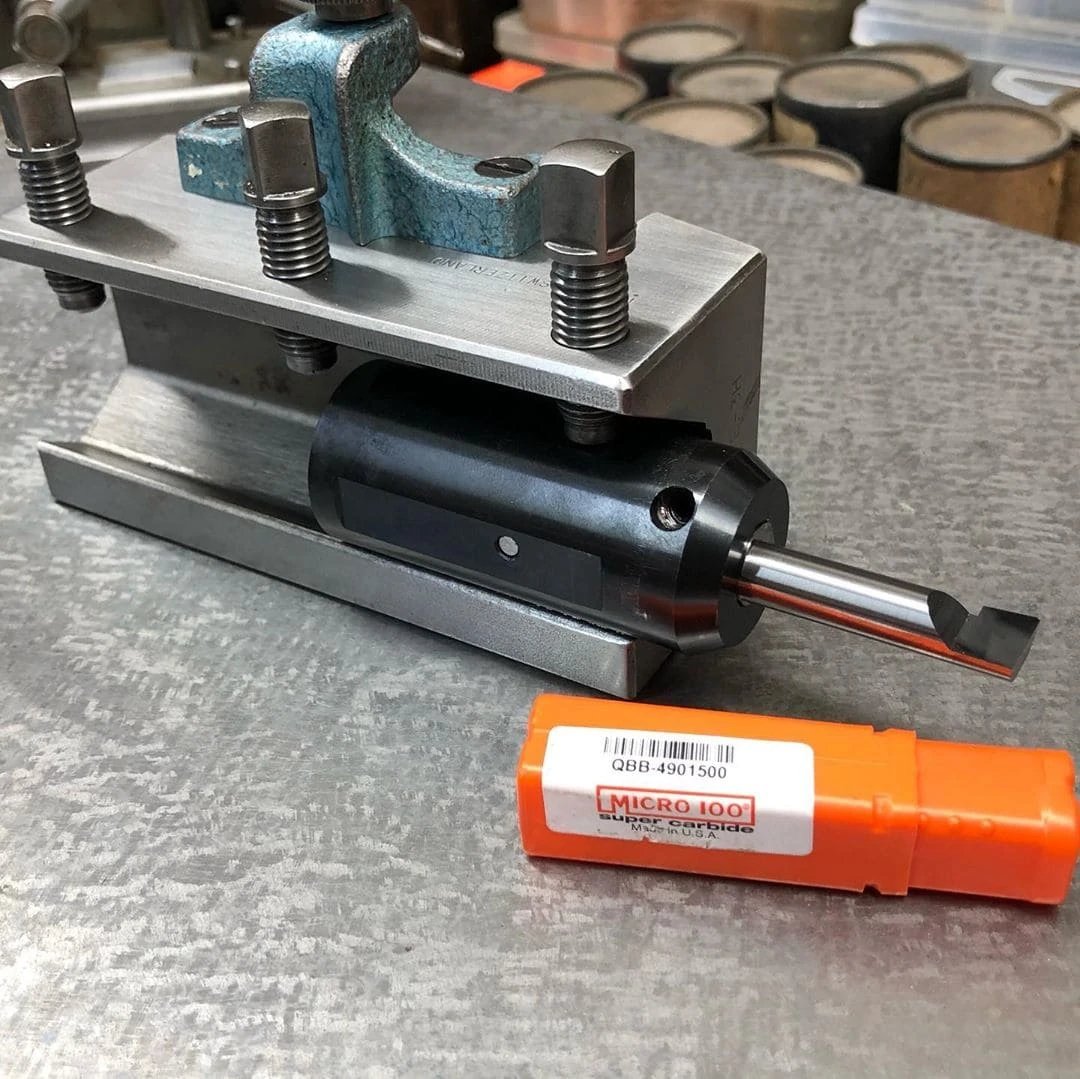 lathe tool holder next to micro 100 tool product packaging 